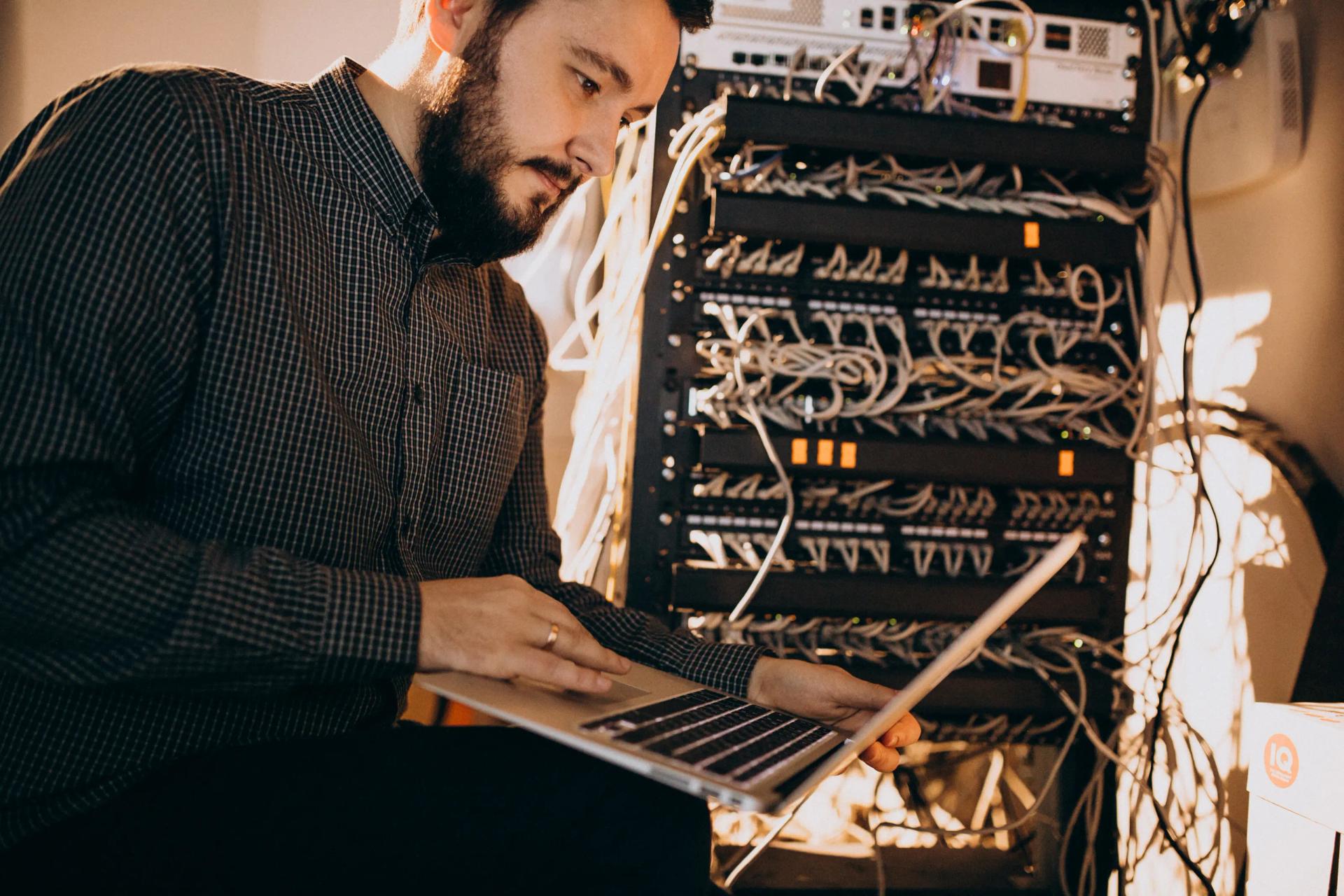 IT service technician repairing computer